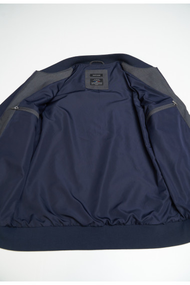 Zoom sur l'intérieur du blouson LEVY bi-matière gris et marine. Il comporte 2 poches intérieures.