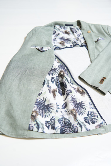 Zoom sur l’intérieur de la veste de costume GIORGIO céladon. La doublure à motif, elle comporte 2 poches intérieures.