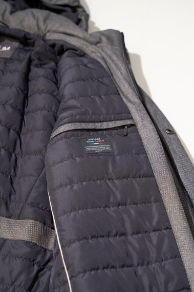 Zoom sur l'intérieur de la parka KERAMA grise. Elle comporte 2 poches intérieures.